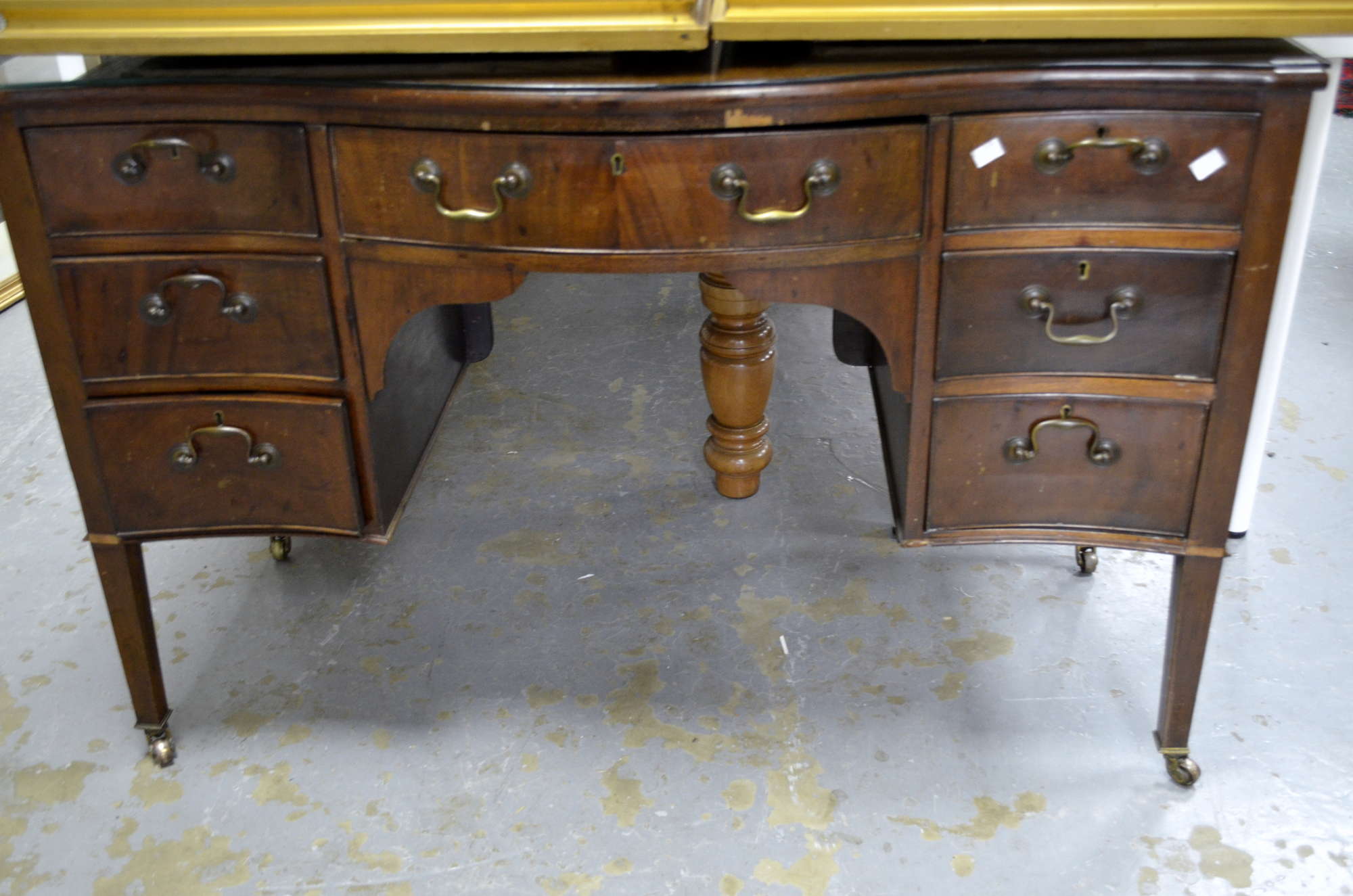 Appraisal: Mahogany serpentine side table with five drawers