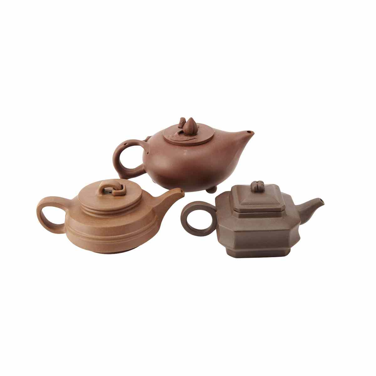 Appraisal: Three Yixing Teapots The first with rounded sides and a