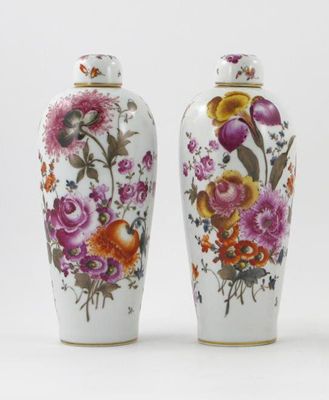 Appraisal: A pair of Dresden vases and lids decorated with floral