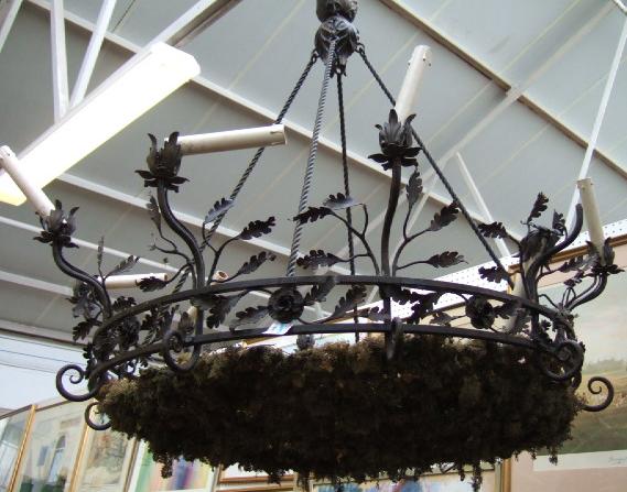 Appraisal: A continental wrought iron ten light chandelier mid th century