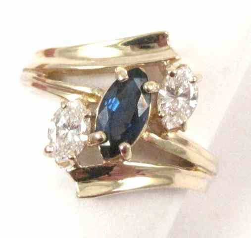 Appraisal: SAPPHIRE DIAMOND AND YELLOW GOLD RING The k gold ring