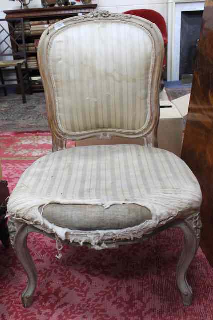 Appraisal: A FRENCH BEECH WOOD FAUTEUIL with upholstered back and seat