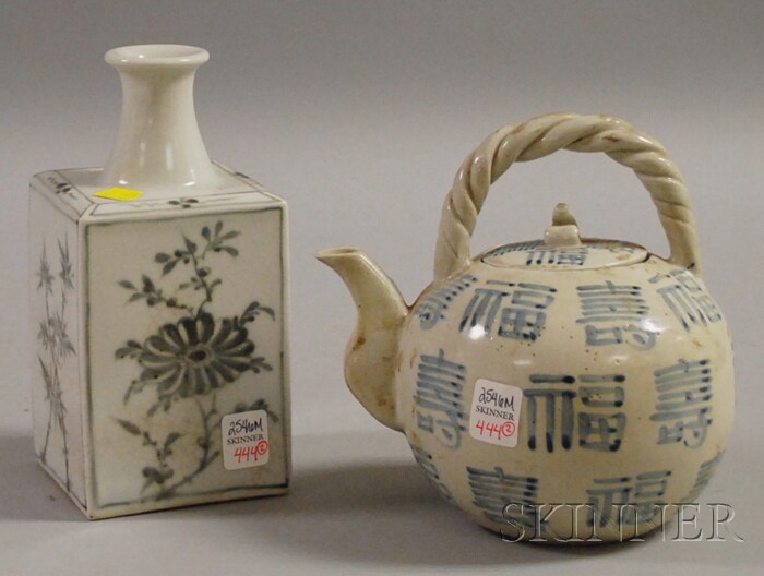 Appraisal: Two Asian Porcelain Items a black-and-white square bottle decorated in