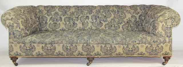 Appraisal: An upholstered Chesterfield sofa with deep buttoned back seat and