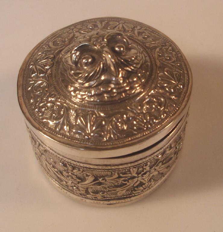 Appraisal: An Indian silver plated cylindrical patch box with hinged cover