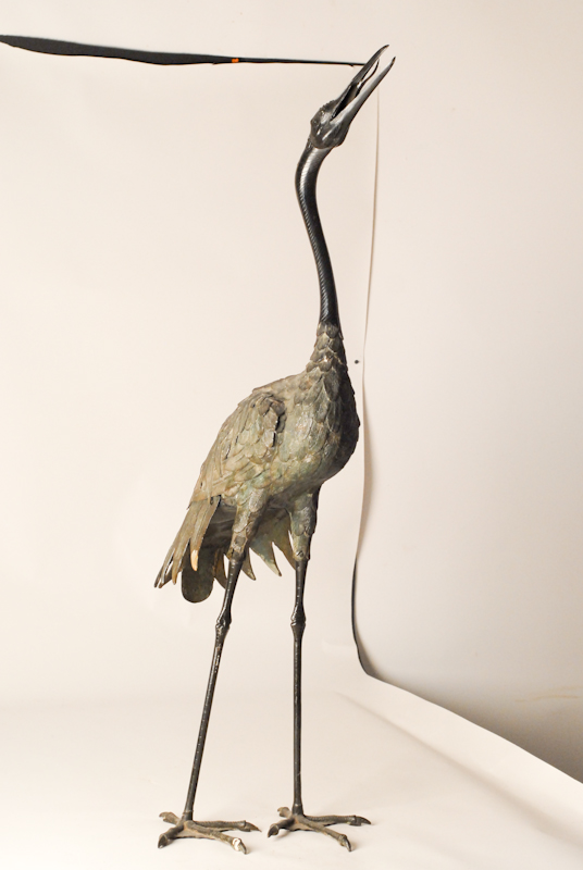 Appraisal: A Large Bronze Standing Crane having a dark brown patina