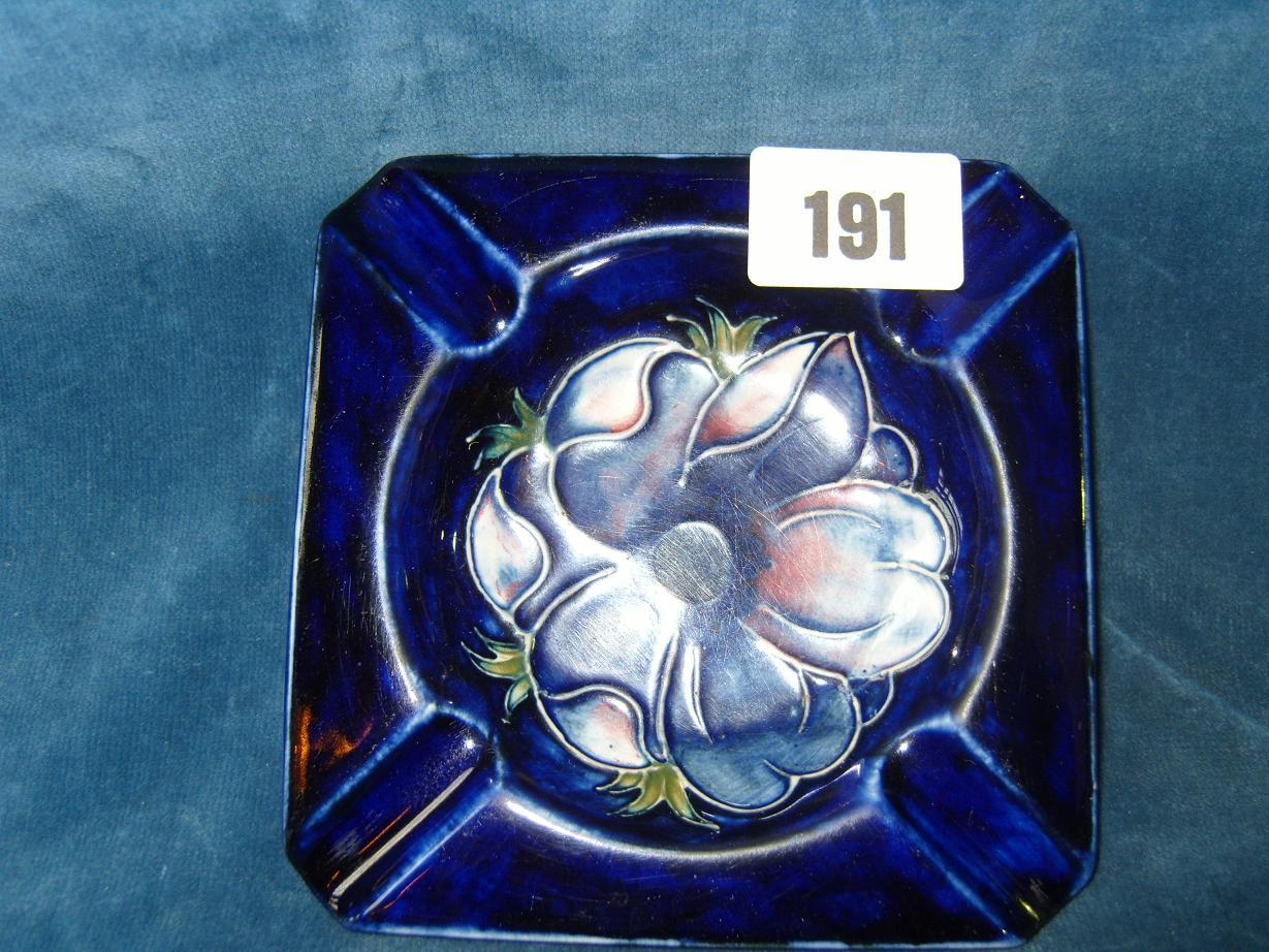 Appraisal: A Moorcroft blue ground ashtray of square shaped form with