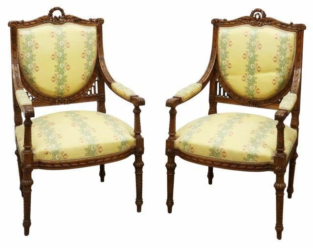 Appraisal: pair Louis XVI style walnut armchairs late th c carved