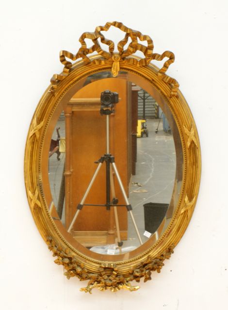 Appraisal: A French late th century oval gilt mirror in Louis