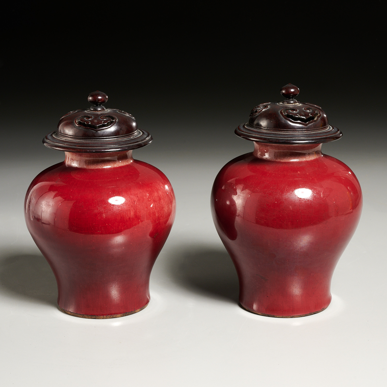 Appraisal: PAIR CHINESE OXBLOOD GLAZED PORCELAIN JARS Qing Dynasty th th