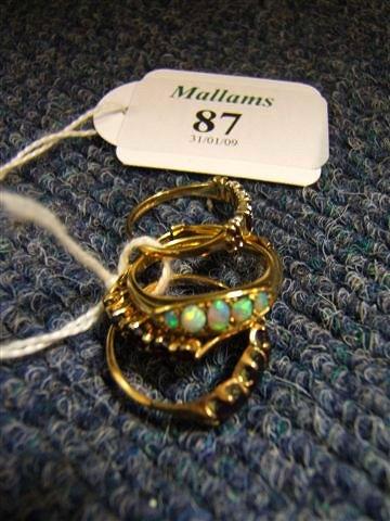 Appraisal: An opal set gold ring and four further decorative rings