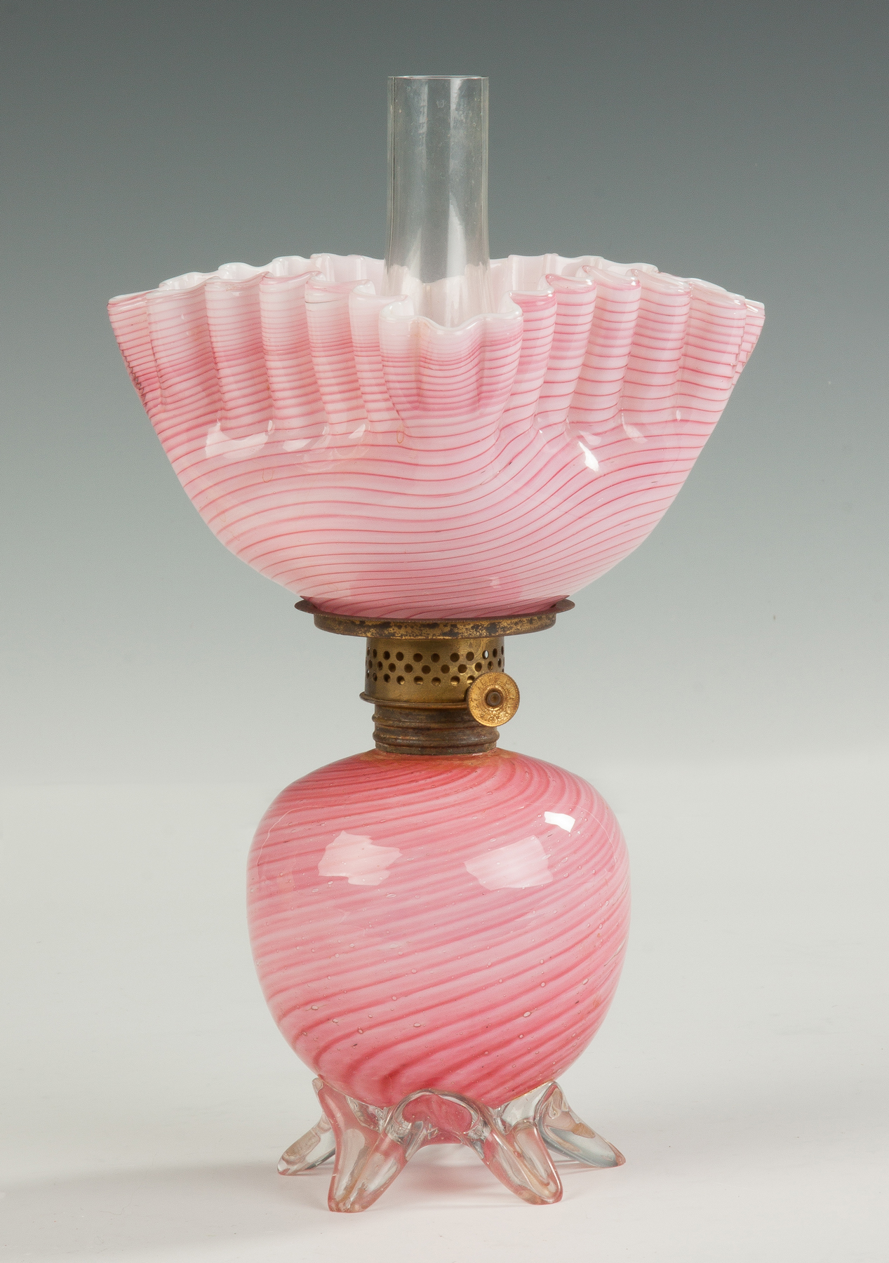 Appraisal: Victorian Cased Glass Miniature Oil Lamp With pink Nailsea glass