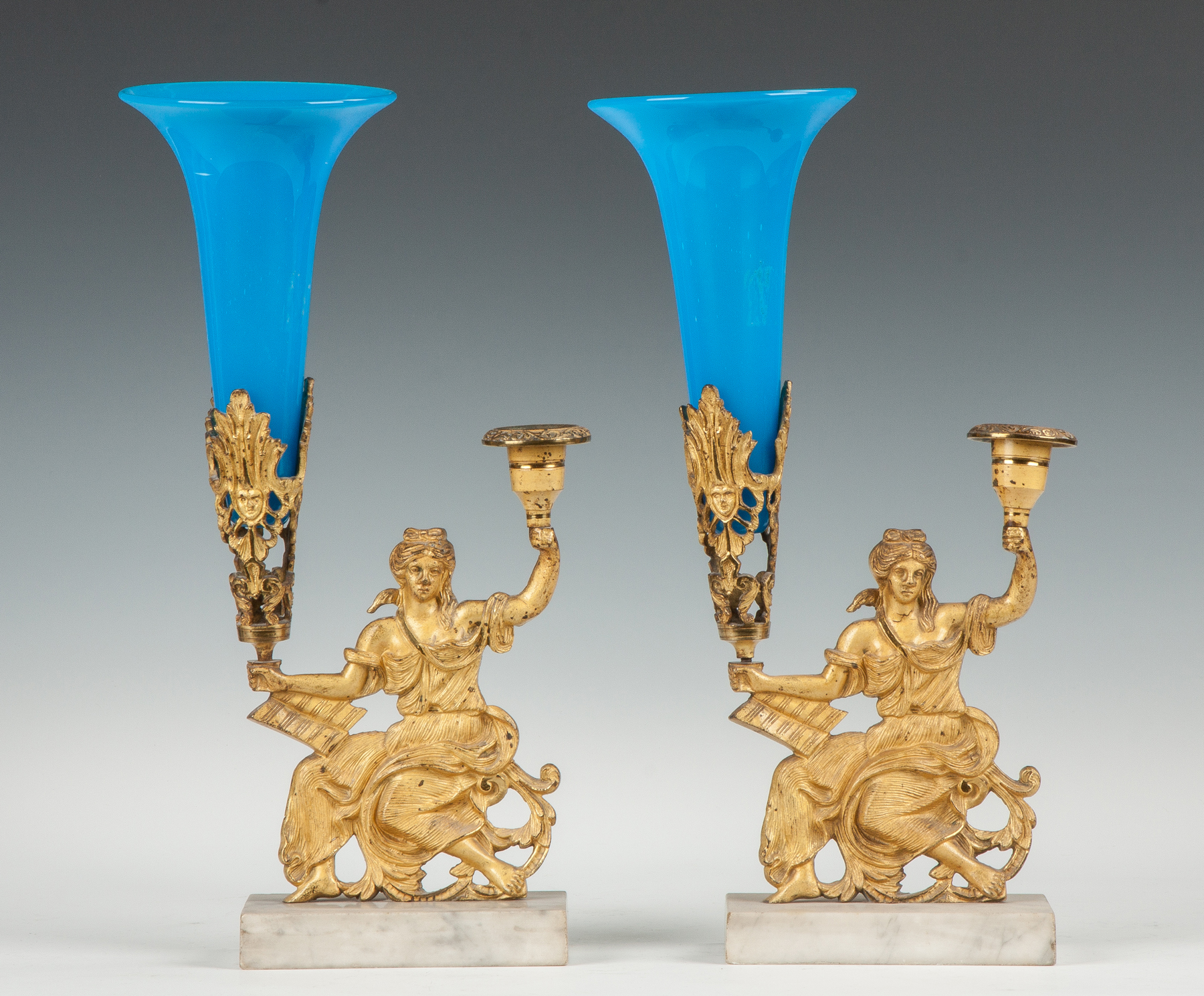 Appraisal: Pair of Gilt Bronze Candle Holders with Classical Figures Early