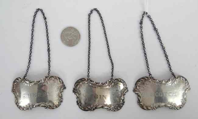 Appraisal: Lot three sterling silver liquor bottle labels ''Scotch'' ''Gin'' ''Sherry''