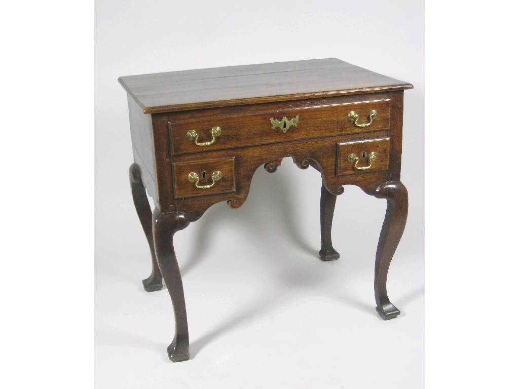 Appraisal: An th Century oak Lowboy fitted one long and two