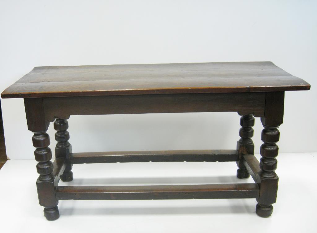 Appraisal: An antique oak Refectory Table with plank top on turned