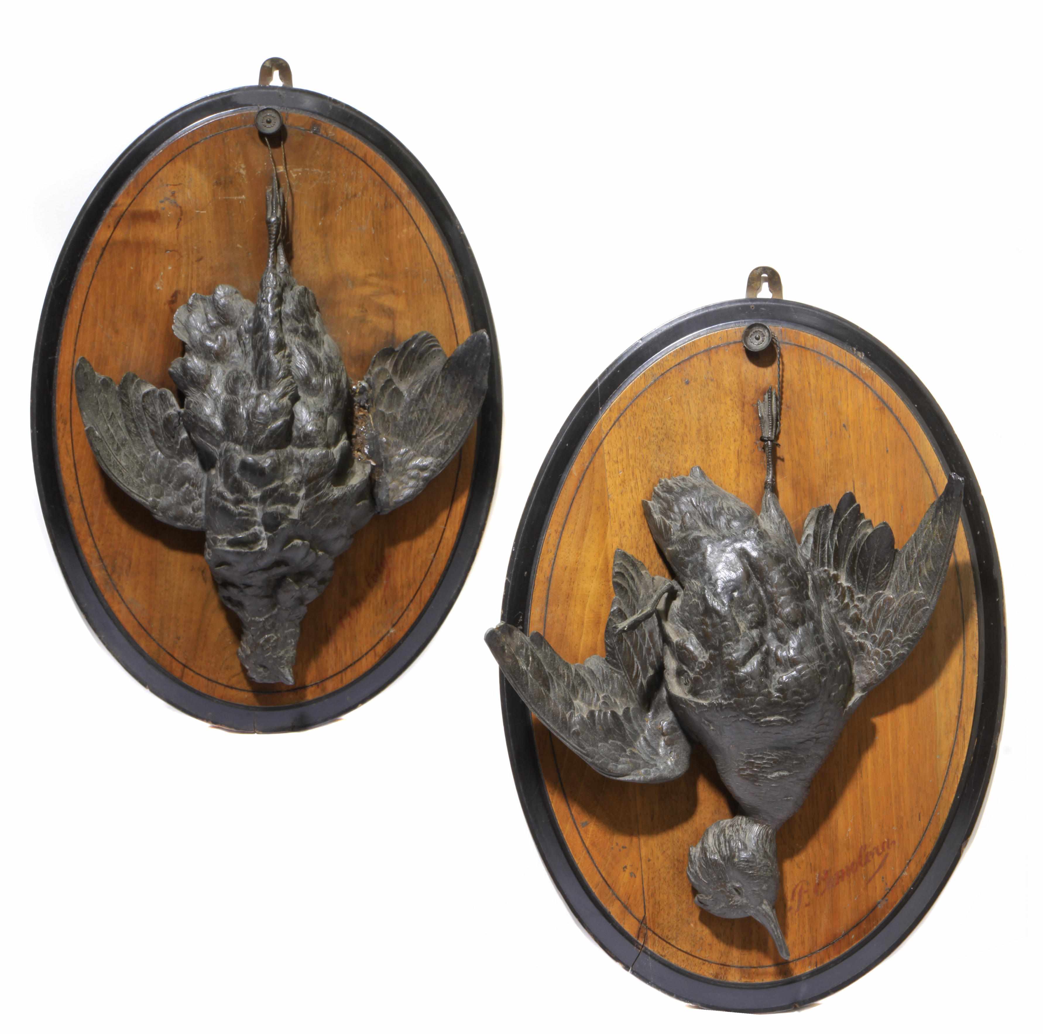 Appraisal: A pair of Continental style patinated metal trophy plaques depicting