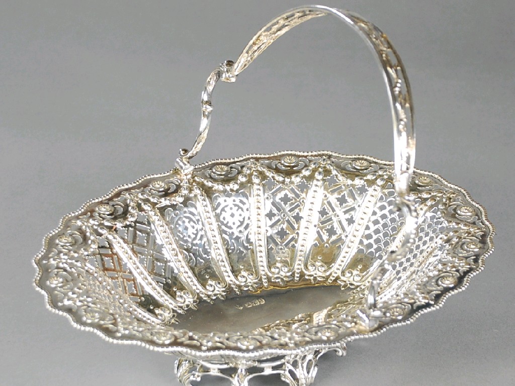 Appraisal: VICTORIAN SILVER ORNATELY PIERCED AND EMBOSSED OVAL CAKE BASKET with