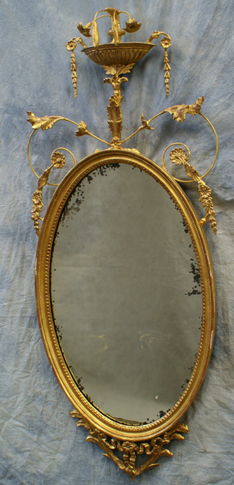 Appraisal: Gilt Federal style oval wall mirror with urn top tall