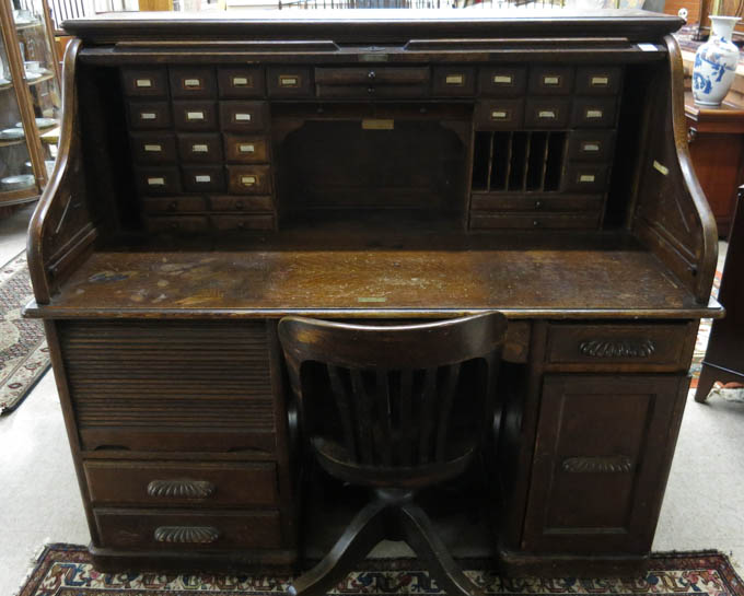 Appraisal: AN OAK ROLL-TOP DESK WITH CHAIR E H Stafford Bros