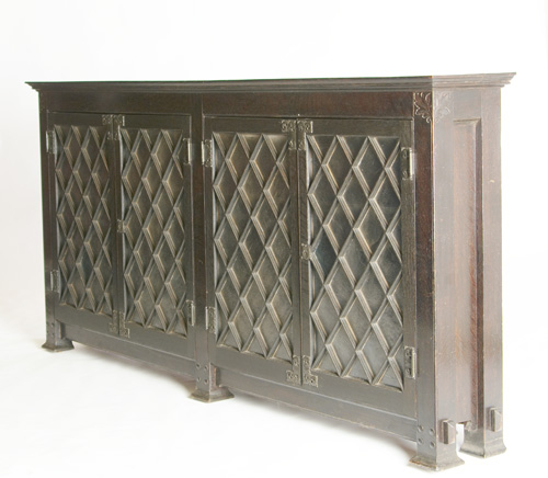 Appraisal: ARTS CRAFTS Large four-door bookcase with diamond-shaped mullions textured glass