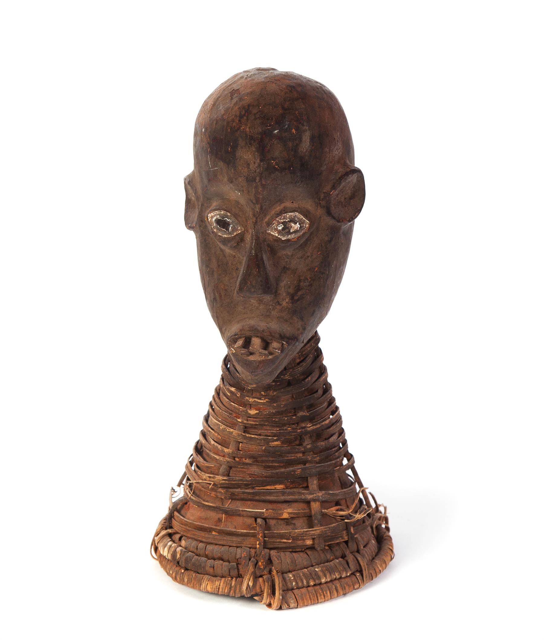 Appraisal: AFRICAN CARVED HEAD Twentieth century Elongated with wooden teeth and