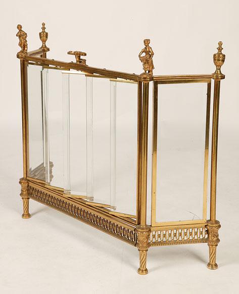 Appraisal: A FRENCH GILT METAL AND GLASS FIRESCREEN the front with