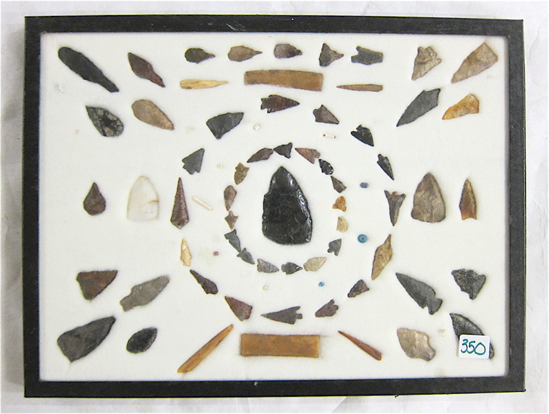 Appraisal: FRAME OF FIFTY-SEVEN NATIVE AMERICAN CHIPPED STONE IMPLEMENTS collected Sauvies