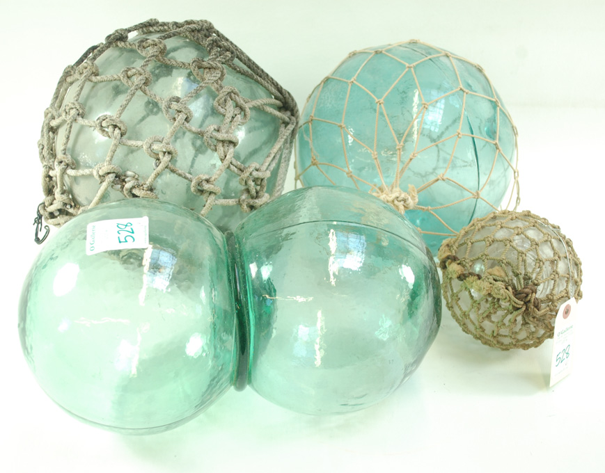 Appraisal: FOUR JAPANESE GLASS FISHING FLOATS the first a double made