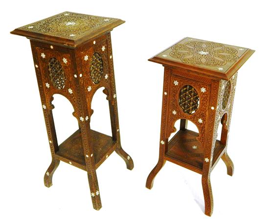 Appraisal: Two similar Indian carved stands with mother-of-pearl inlay decoration scroll