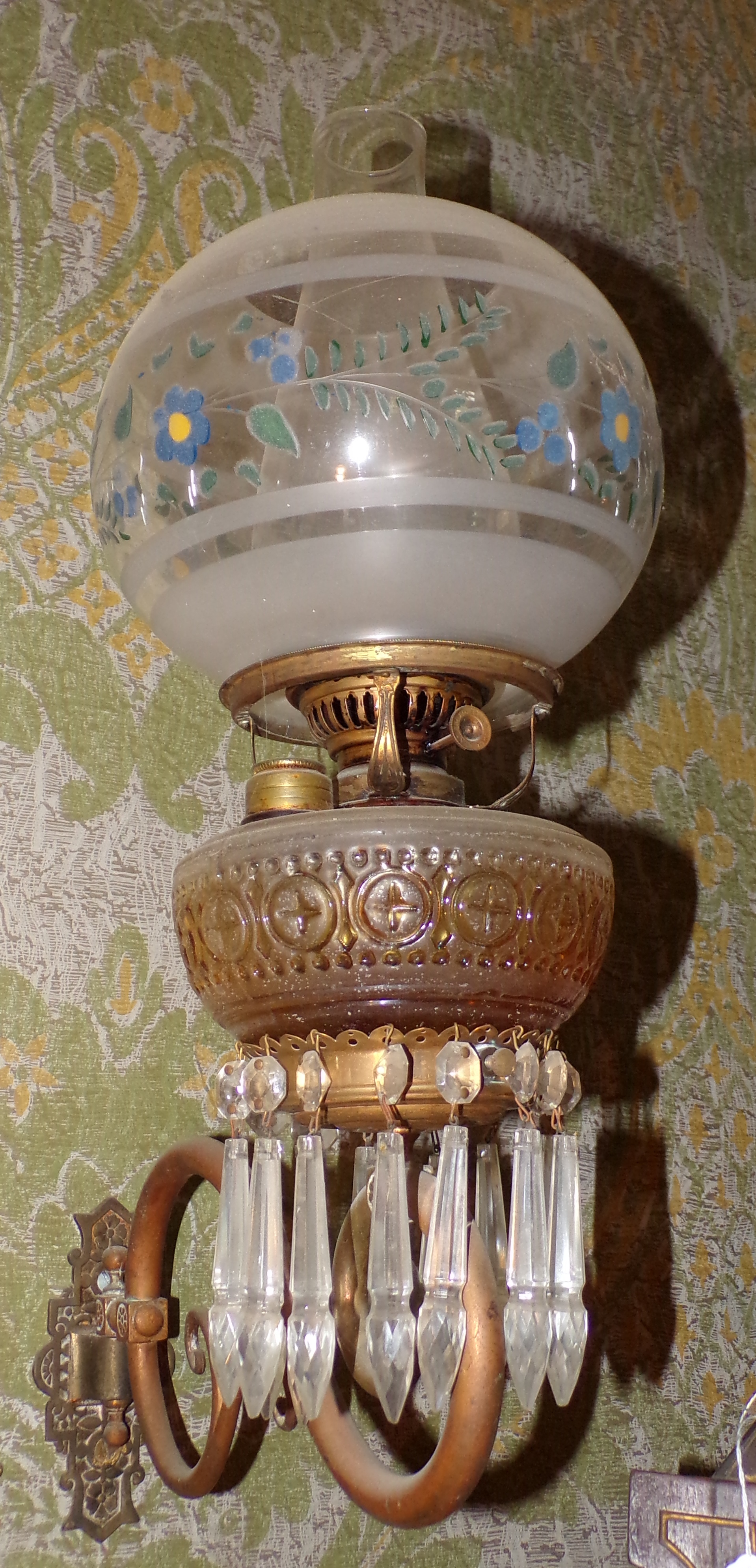 Appraisal: Oil lamp with wall bracket frosted and etched glass shade