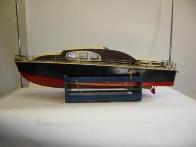 Appraisal: A model cabin cruiser painted and varnished wood construction powered