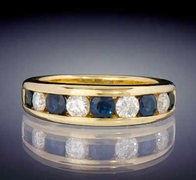 Appraisal: A Ladies' Diamond and Sapphire Band k yellow gold ring