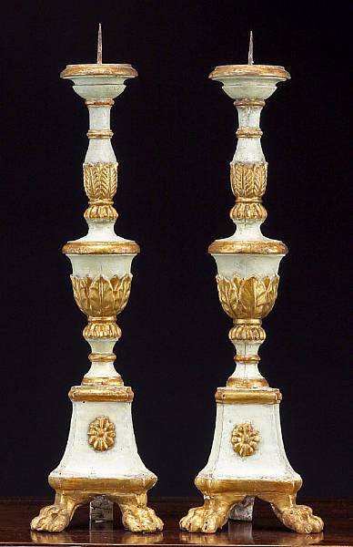 Appraisal: A pair of Italian Neoclassical polychrome and parcel giltwood pricket