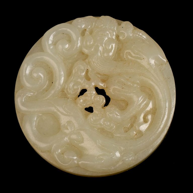 Appraisal: JADE BI The bi is carved in high relief with