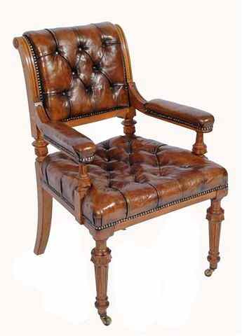 Appraisal: A VICTORIAN OAK DESK CHAIR upholstered in deep button brown