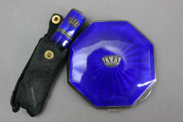 Appraisal: A silver and enamel powder compact and matching lipstick by