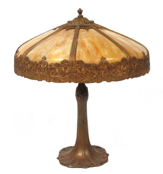 Appraisal: An American patinated metal and slag glass table lamp early