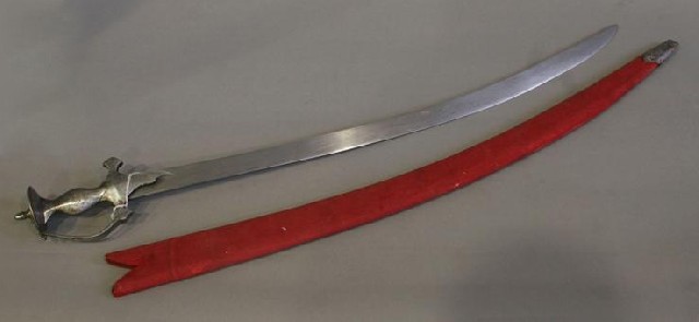 Appraisal: An Indian tulwar steel hilt with plaing inch curved blade