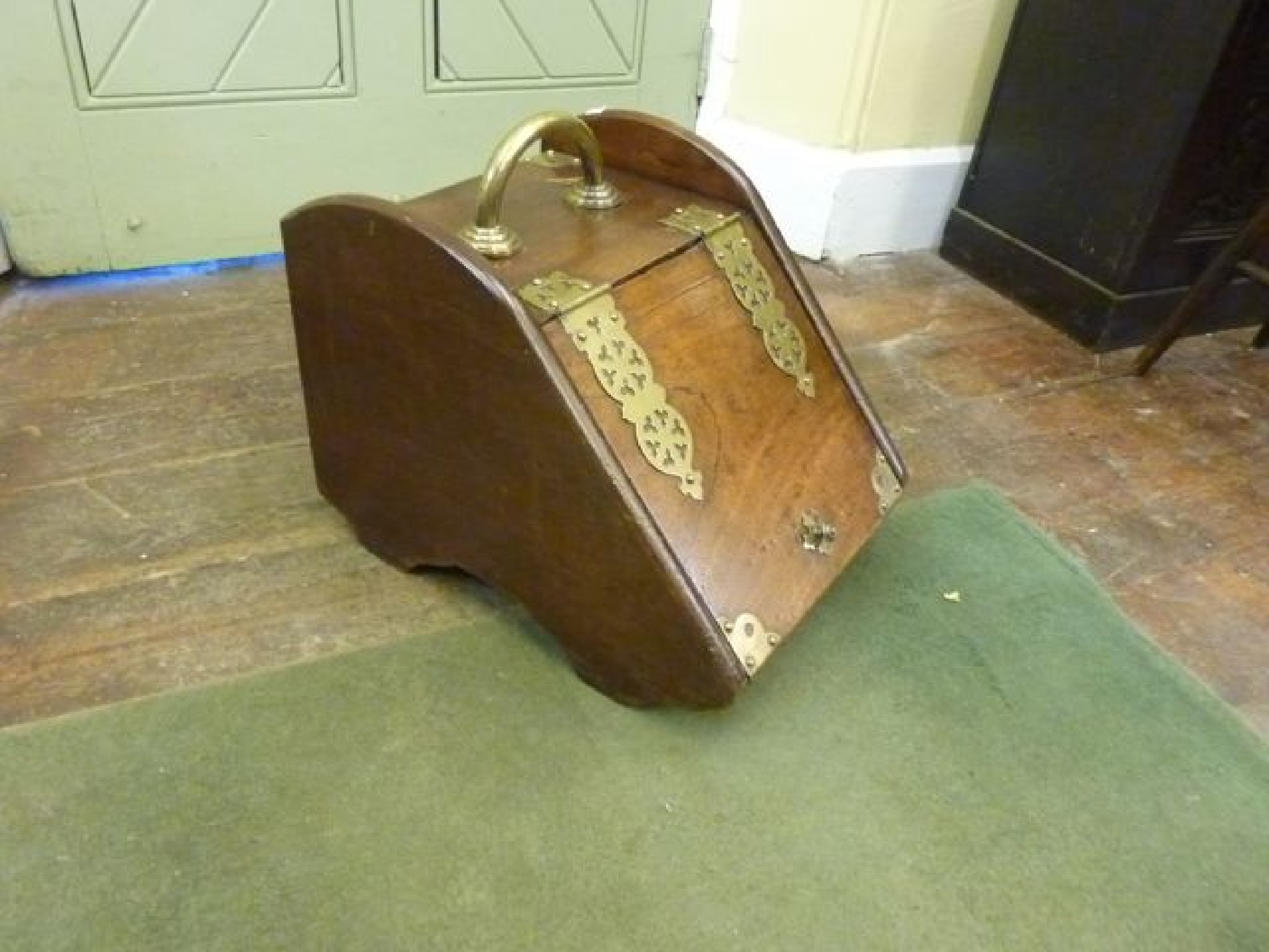 Appraisal: A Victorian mahogany coal scuttle with brass mounts