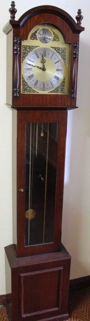 Appraisal: A modern Tempus Fugit longcase clock the arched hood revealing