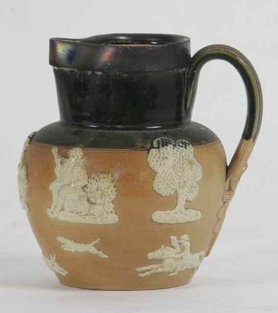 Appraisal: A Royal Doulton earthenware jug moulded with a hunting scene