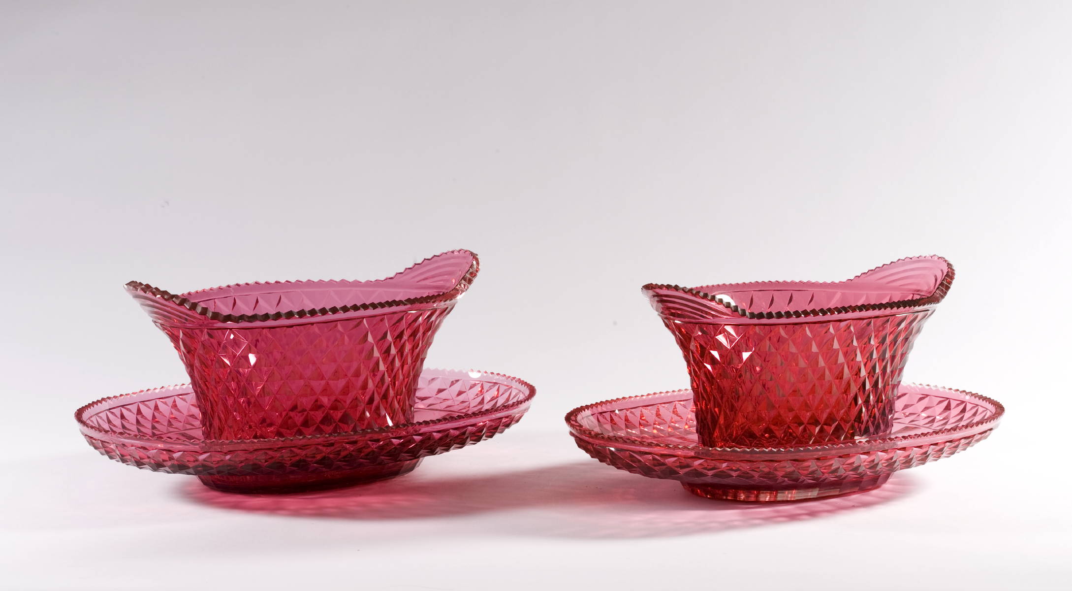 Appraisal: PAIR OF CRANBERRY SAW-TOOTH CUT GLASS OVAL SWEET MEAT DISHES