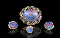 Appraisal: A Four Piece Suite of k Diamond and Opal Triplets