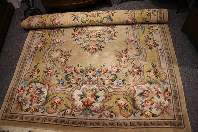 Appraisal: A CHINESE IVORY GROUND SMALL CARPET with floral and foliate