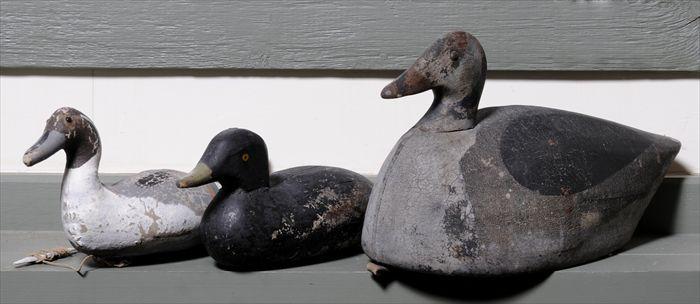 Appraisal: TWO PAINTED CANVAS-COVERED DUCK DECOYS AND A WOOD DECOY to