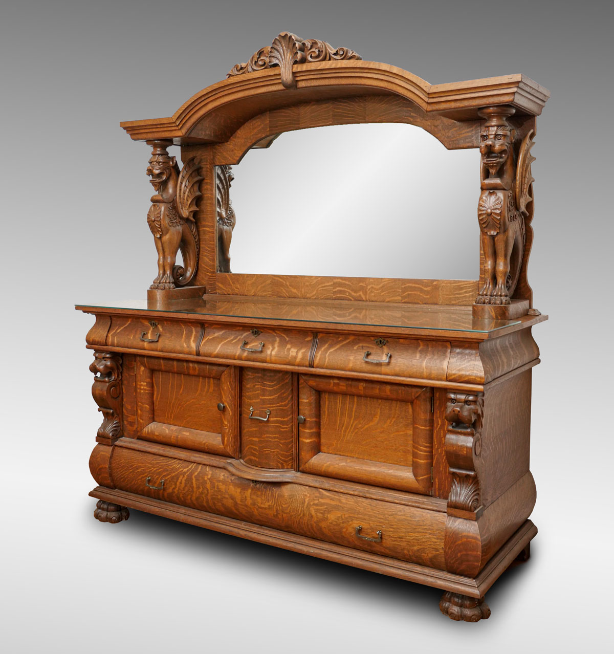 Appraisal: HORNER ERA CARVED TIGER OAK GRIFFIN SIDEBOARD WITH MIRROR Tiger