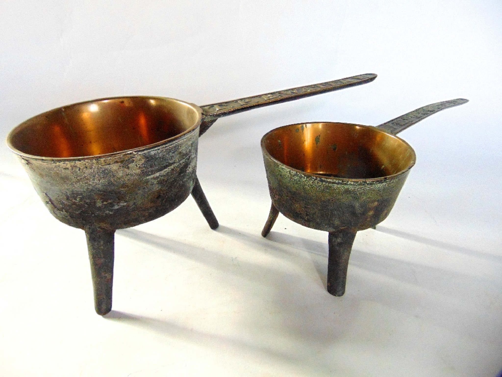 Appraisal: One large and one smaller Georgian metalwork skillets probably bell