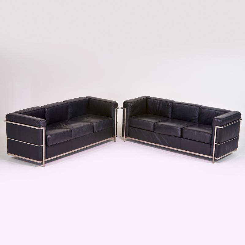 Appraisal: AFTER LE CORBUSIER Pair of sofas s Chromed steel leather