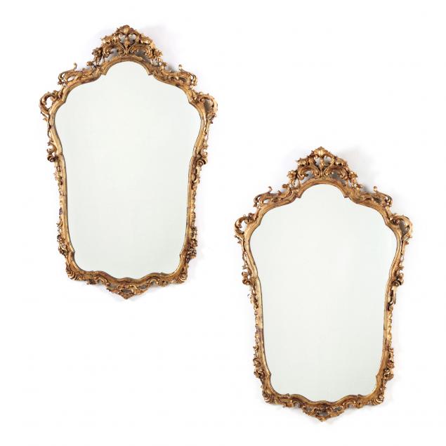 Appraisal: PAIR OF ITALIAN ROCOCO STYLE CARVED AND GILT MIRRORS Mid-